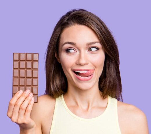 lady holding up a bar of chocolate