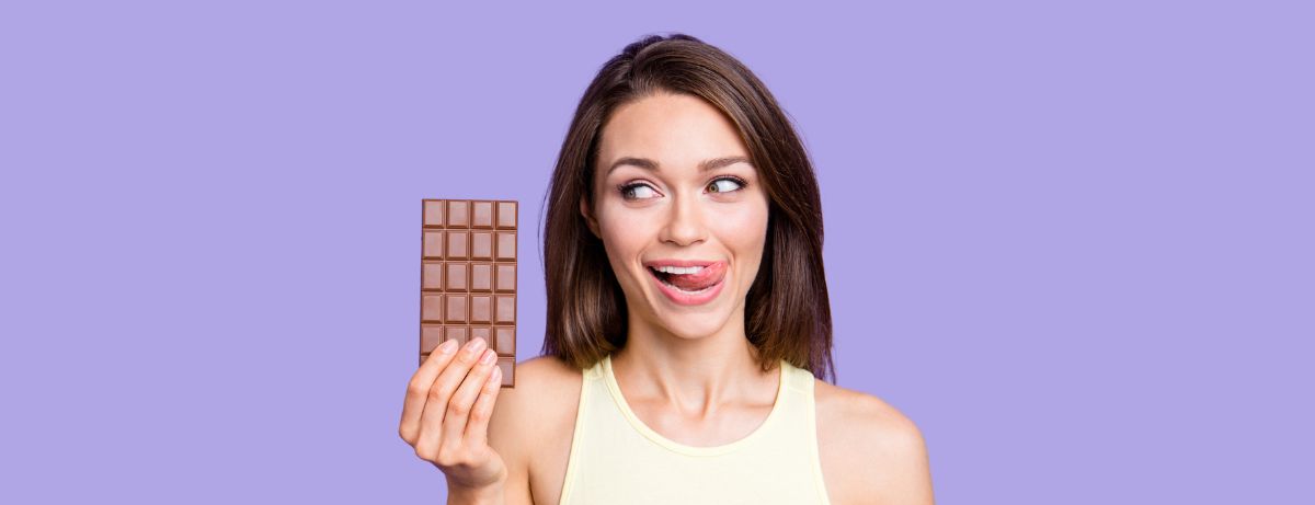 lady holding up a bar of chocolate